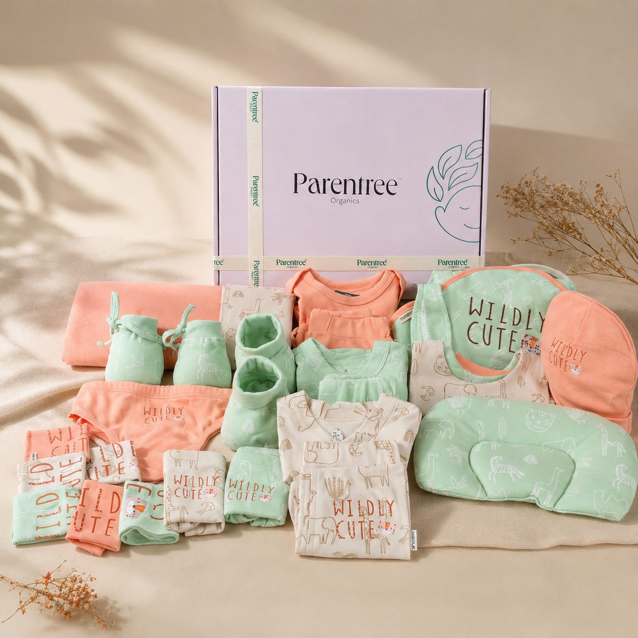 Organic baby gift set flat-lay with box and card